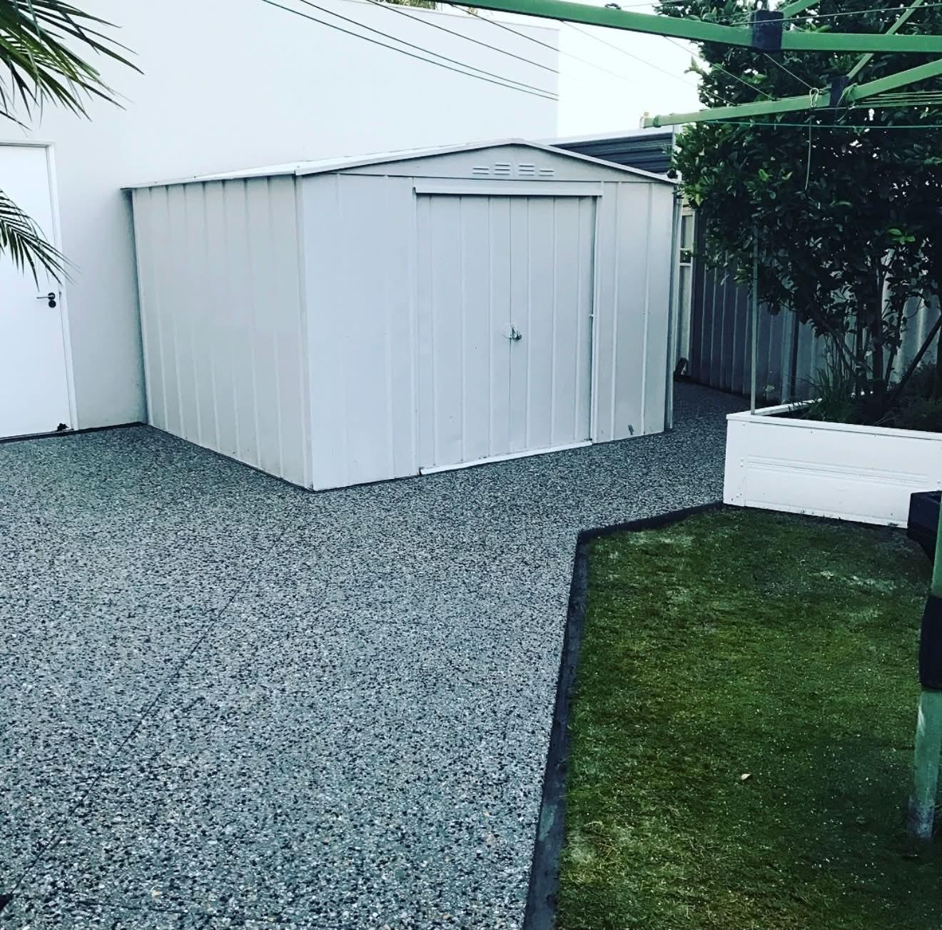 Well-maintained exposed aggregate yard