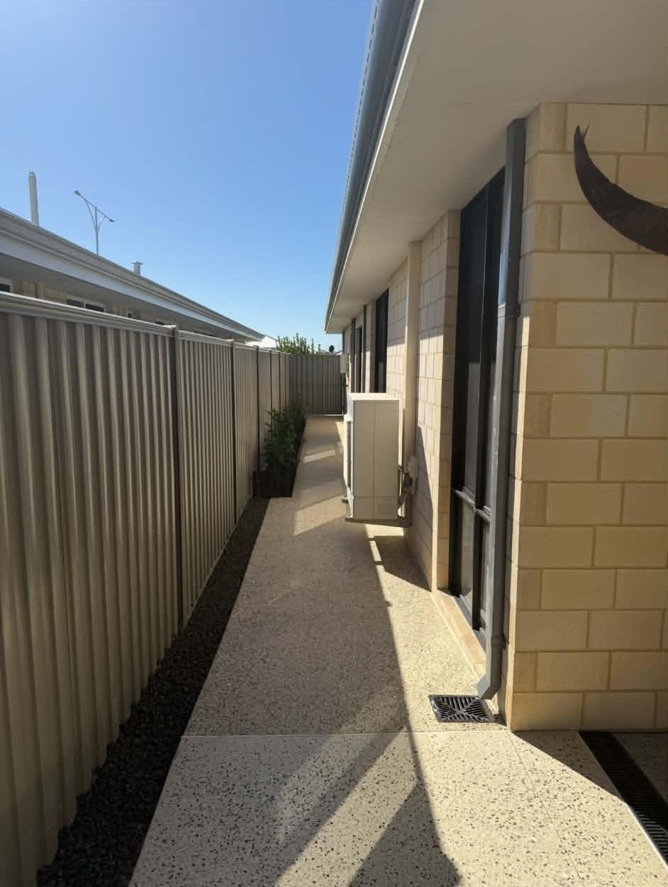 Honed concrete side walkway